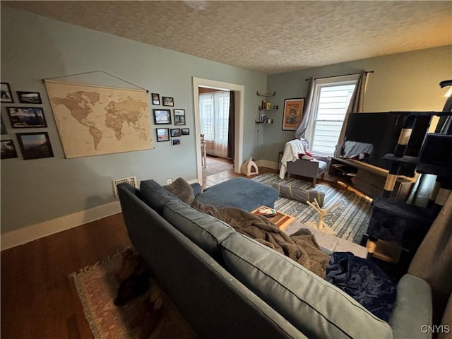 513 Tennyson Ave Unit 15, Syracuse, NY 13204 - living room featuring a textured ceiling, wood finished floors, and baseboards