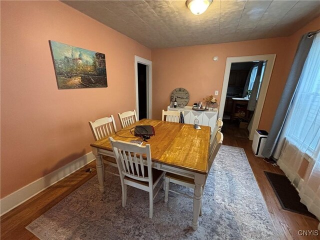 513 Tennyson Ave Unit 15, Syracuse, NY 13204 - dining area featuring wood finished floors and baseboards