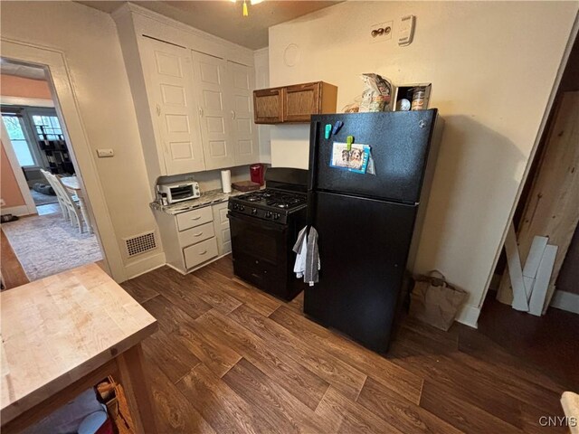 513 Tennyson Ave Unit 15, Syracuse, NY 13204 - kitchen featuring black appliances, dark wood-style flooring, brown cabinetry, light countertops, and baseboards