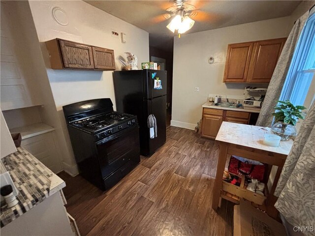 513 Tennyson Ave Unit 15, Syracuse, NY 13204 - kitchen with black appliances, dark wood finished floors, brown cabinetry, ceiling fan, and light countertops