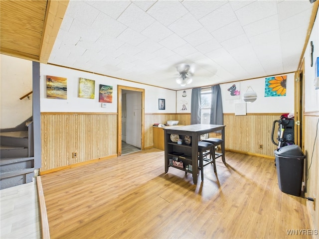 1847 Tuscarora Rd, Niagara, NY 14304 - dining room with a wainscoted wall, light wood-type flooring, ceiling fan, and stairway