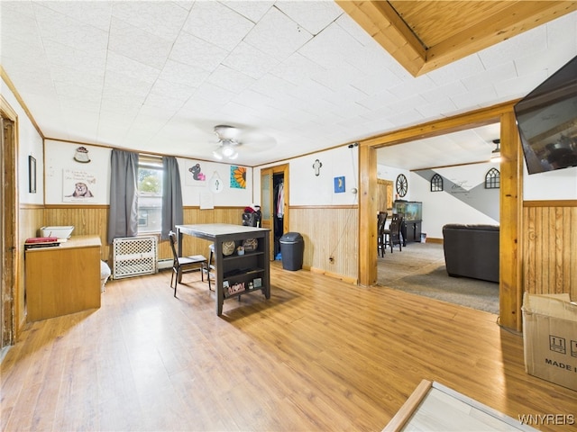 1847 Tuscarora Rd, Niagara, NY 14304 - dining space featuring wainscoting, wooden walls, ceiling fan, and wood finished floors
