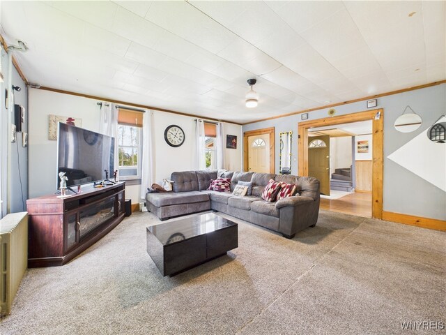 1847 Tuscarora Rd, Niagara, NY 14304 - carpeted living area with crown molding and stairway