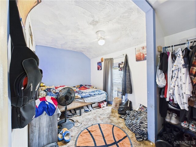 1847 Tuscarora Rd, Niagara, NY 14304 - bedroom featuring lofted ceiling, carpet floors, and a textured ceiling
