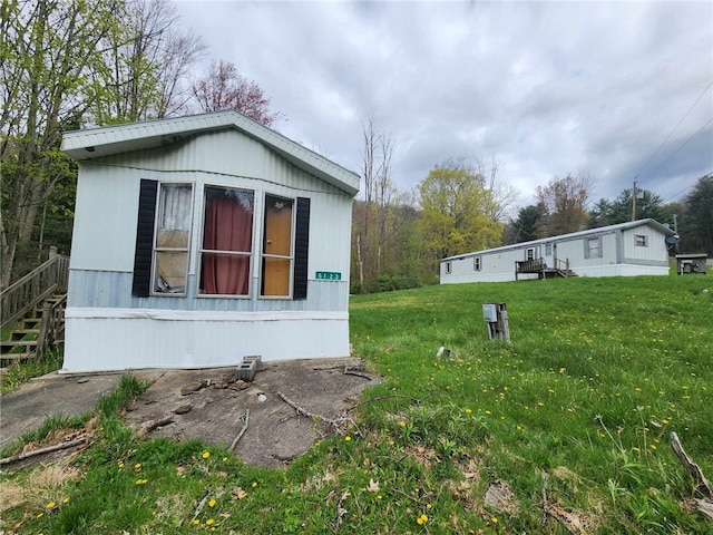 5123 Wixon Rd Unit 3, Campbell, NY 14870 - view of property exterior featuring a yard