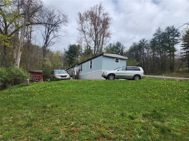 5123 Wixon Rd Unit 3, Campbell, NY 14870 - view of home's exterior featuring a yard