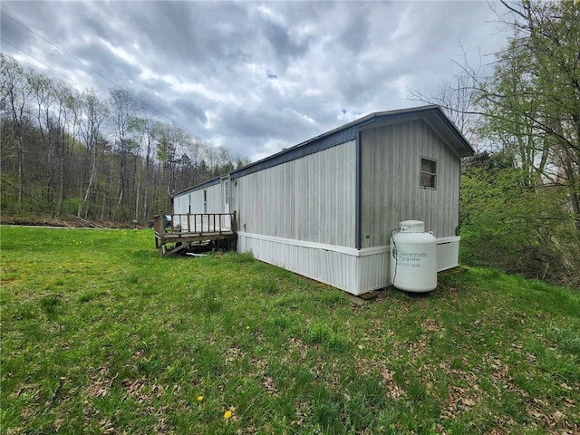 5123 Wixon Rd Unit 3, Campbell, NY 14870 - view of property exterior featuring a lawn and a wooden deck