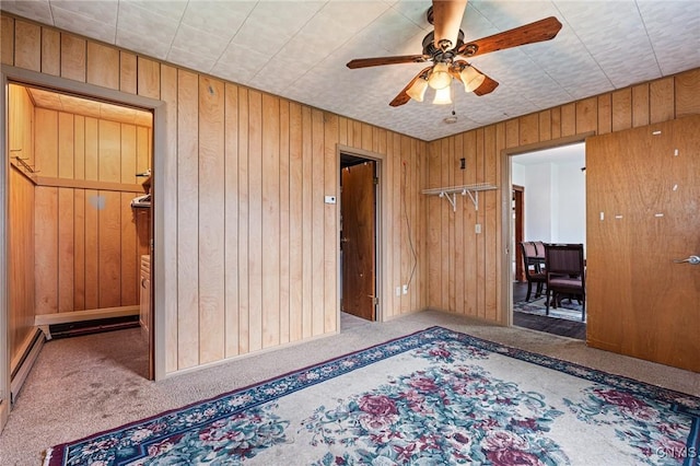 8 Washington St, Alexandria, NY 13607 - unfurnished room with carpet flooring, a ceiling fan, and wood walls