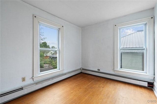 8 Washington St, Alexandria, NY 13607 - empty room with plenty of natural light, light wood-style flooring, and baseboard heating