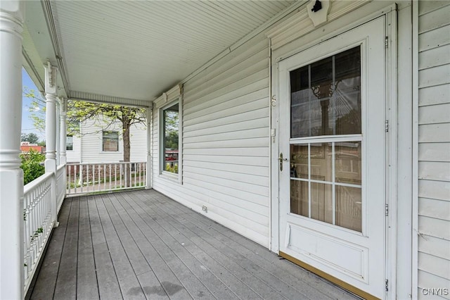 8 Washington St, Alexandria, NY 13607 - wooden terrace featuring covered porch