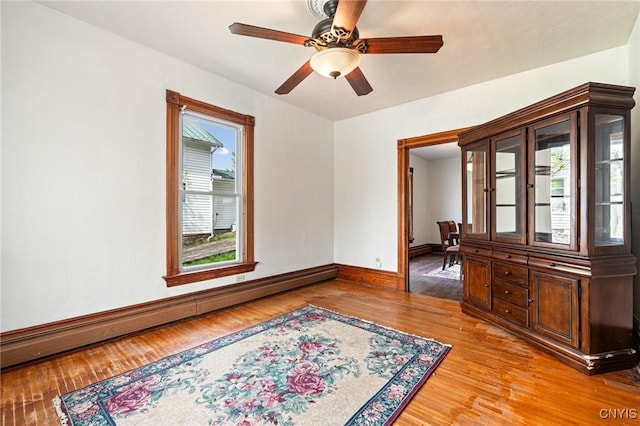 8 Washington St, Alexandria, NY 13607 - empty room with baseboard heating, light wood finished floors, baseboards, and a ceiling fan