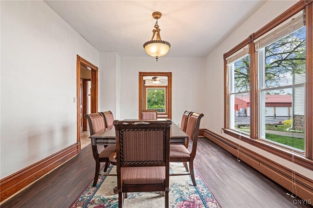 8 Washington St, Alexandria, NY 13607 - dining room with a baseboard radiator, dark wood-style floors, baseboards, and a ceiling fan
