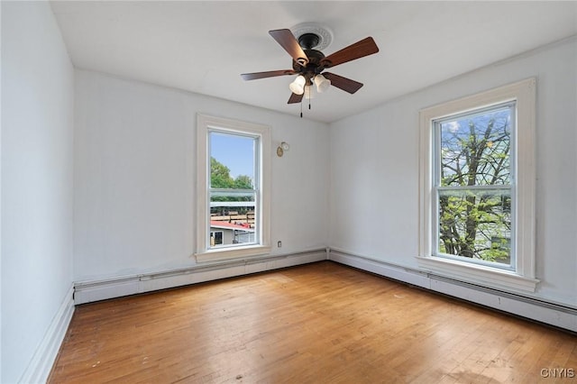 8 Washington St, Alexandria, NY 13607 - empty room featuring healthy amount of natural light, light wood-style floors, and ceiling fan