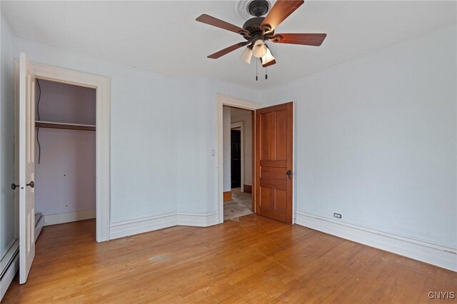 8 Washington St, Alexandria, NY 13607 - unfurnished bedroom with light wood-type flooring, a closet, baseboards, and ceiling fan