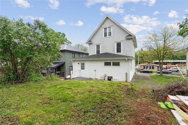 8 Washington St, Alexandria, NY 13607 - rear view of house featuring a yard