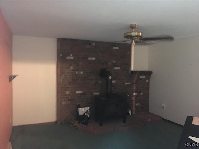7653 Windsor Dr N, Clay, NY 13212 - living area with a wood stove and a ceiling fan
