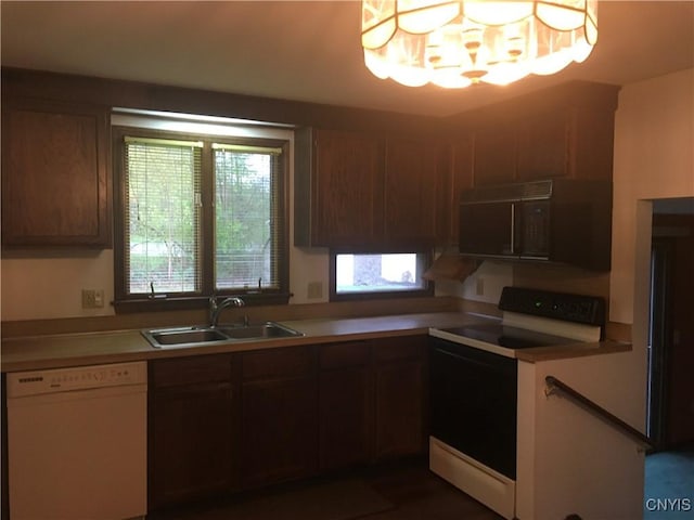 7653 Windsor Dr N, Clay, NY 13212 - kitchen with white appliances, a sink, and light countertops