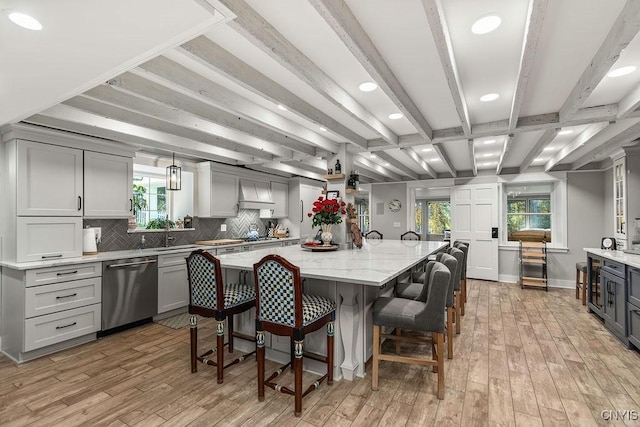 3721 Cold Springs Rd, Lysander, NY 13027 - kitchen featuring stainless steel dishwasher, light wood-type flooring, a breakfast bar, gray cabinets, and beam ceiling