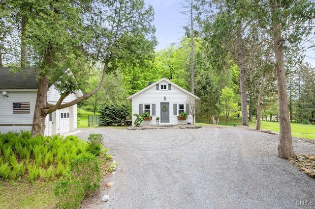 3721 Cold Springs Rd, Lysander, NY 13027 - bungalow-style house with gravel driveway, an outbuilding, and a garage