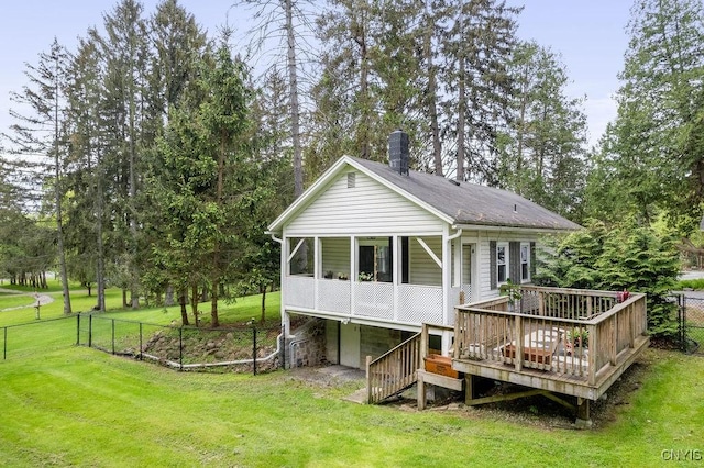 3721 Cold Springs Rd, Lysander, NY 13027 - rear view of house with a wooden deck, an attached garage, and view of wooded area