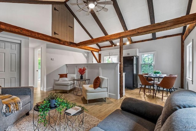 3721 Cold Springs Rd, Lysander, NY 13027 - living room with a ceiling fan, high vaulted ceiling, beamed ceiling, light wood-style flooring, and a baseboard radiator