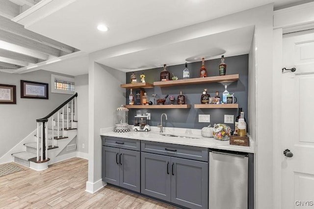 3721 Cold Springs Rd, Lysander, NY 13027 - indoor wet bar featuring light wood-style flooring, stairway, recessed lighting, and baseboards