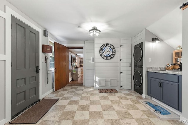 3721 Cold Springs Rd, Lysander, NY 13027 - foyer entrance with estacked washer and dryer