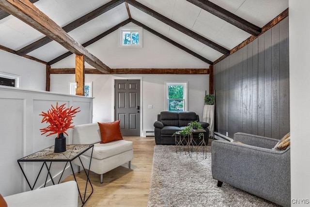 3721 Cold Springs Rd, Lysander, NY 13027 - living room with wood finished floors, beam ceiling, baseboard heating, a baseboard radiator, and high vaulted ceiling