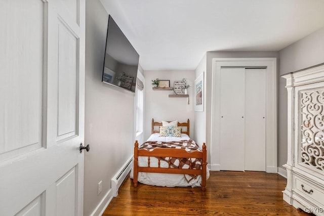 3721 Cold Springs Rd, Lysander, NY 13027 - bedroom with a baseboard heating unit, wood finished floors, and a closet