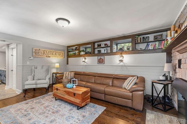 3721 Cold Springs Rd, Lysander, NY 13027 - living area featuring wood finished floors and a wainscoted wall
