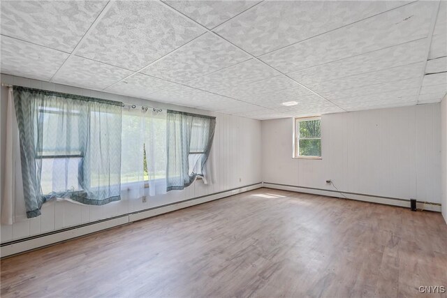 2226 County Route 37, West Monroe, NY 13036 - spare room with wood finished floors and a baseboard radiator