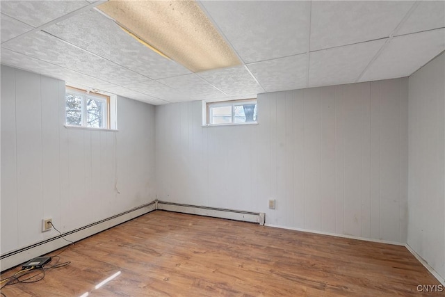below grade area featuring wood finished floors and healthy amount of natural light