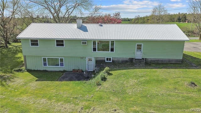 2226 County Route 37, West Monroe, NY 13036 - back of house featuring a lawn, a metal roof, and a chimney