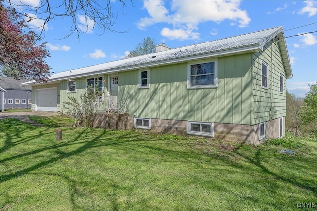 2226 County Route 37, West Monroe, NY 13036 - rear view of house with a yard, driveway, an attached garage, a metal roof, and a chimney