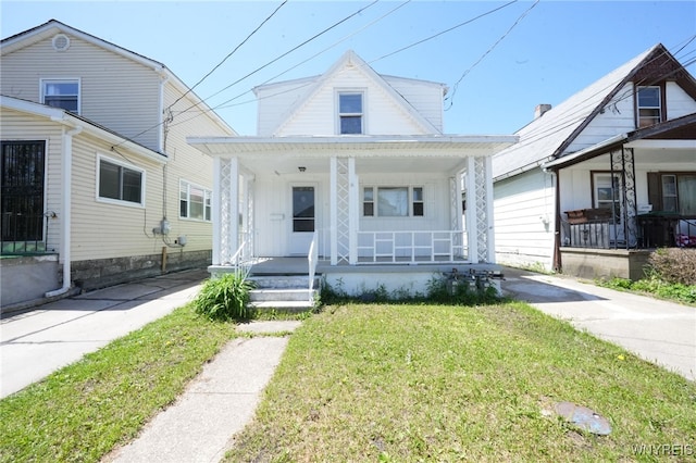 8 Wagner Ave, Cheektowaga, NY 14206 - view of front of home featuring a porch and a front lawn