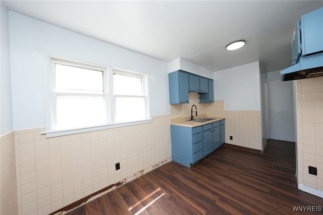 8 Wagner Ave, Cheektowaga, NY 14206 - kitchen featuring blue cabinets, tile walls, a sink, dark wood-style floors, and healthy amount of natural light