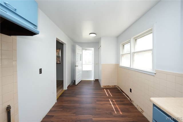 8 Wagner Ave, Cheektowaga, NY 14206 - unfurnished dining area featuring tile walls, a wainscoted wall, and dark wood-type flooring