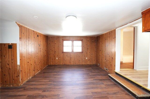 8 Wagner Ave, Cheektowaga, NY 14206 - empty room featuring dark wood-type flooring and wood walls