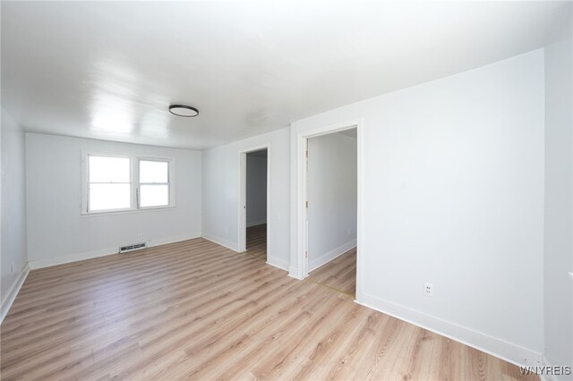 8 Wagner Ave, Cheektowaga, NY 14206 - spare room with baseboards and light wood-style flooring