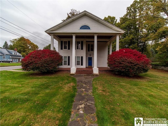 474 Fairmount Ave, Ellicott, NY 14701 - greek revival inspired property featuring a porch and a front yard