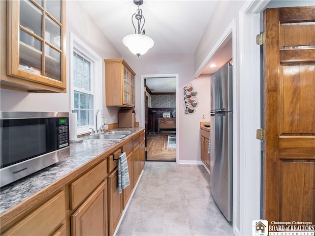 474 Fairmount Ave, Ellicott, NY 14701 - kitchen with stainless steel appliances, a sink, glass insert cabinets, baseboards, and decorative light fixtures