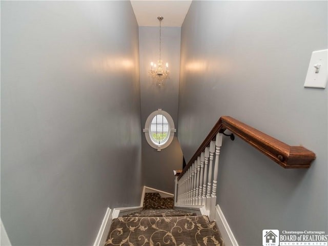 474 Fairmount Ave, Ellicott, NY 14701 - stairs featuring baseboards and a chandelier