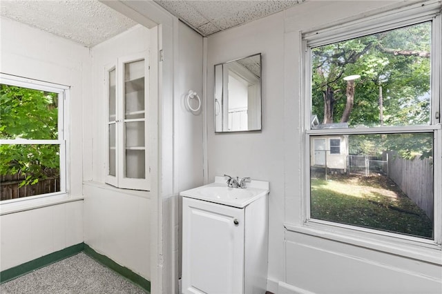 interior space featuring vanity and baseboards