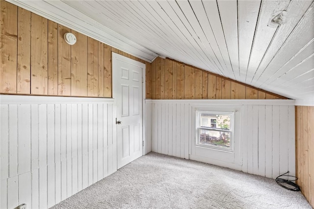 bonus room with vaulted ceiling, light carpet, wooden walls, and wood ceiling