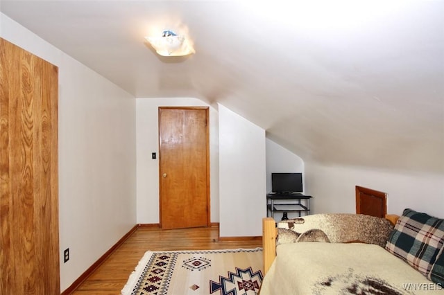 150 Leonard St, Lackawanna, NY 14218 - bedroom featuring vaulted ceiling, light wood-type flooring, and baseboards