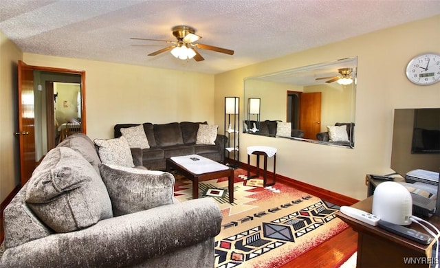150 Leonard St, Lackawanna, NY 14218 - living area with ceiling fan, wood finished floors, a textured ceiling, and baseboards