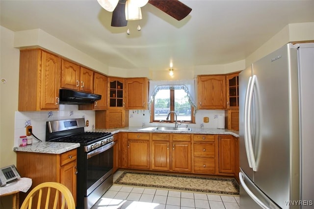 150 Leonard St, Lackawanna, NY 14218 - kitchen with appliances with stainless steel finishes, under cabinet range hood, and brown cabinetry