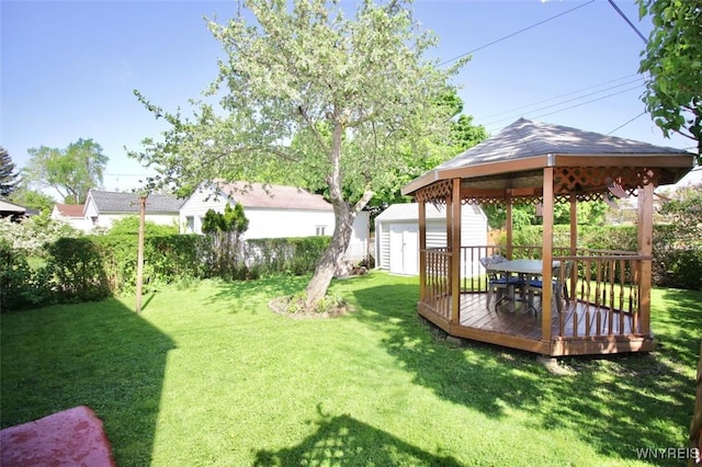 150 Leonard St, Lackawanna, NY 14218 - view of green lawn featuring a gazebo, a shed, an outbuilding, and a wooden deck