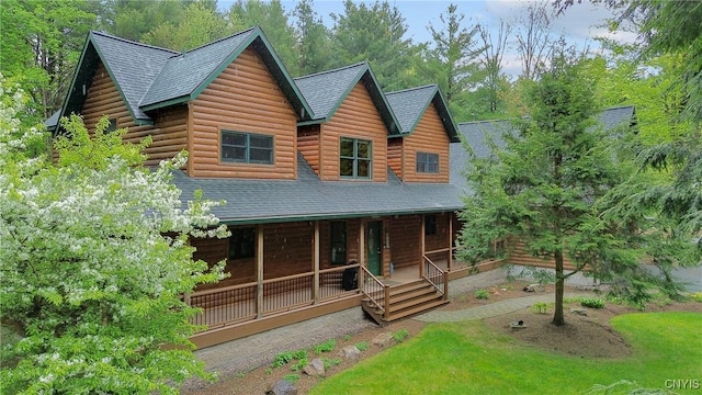 view of front of home featuring a porch and a shingled roof
