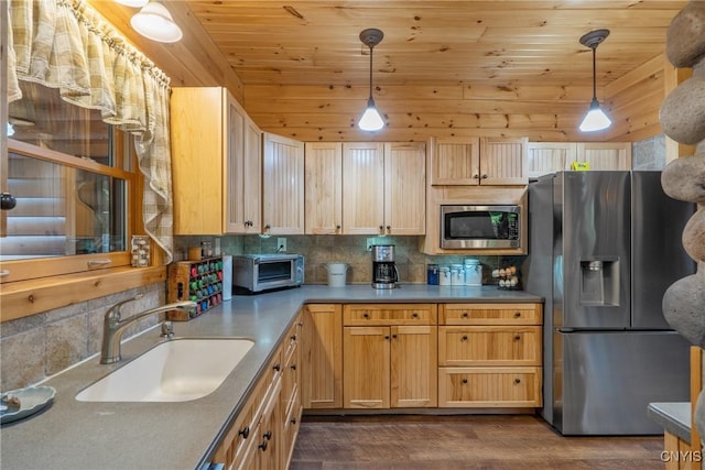 kitchen with appliances with stainless steel finishes, a sink, wood ceiling, dark wood-type flooring, and decorative backsplash
